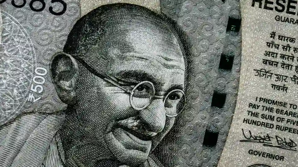 Rupee Falls to Record Low as Market Volatility Keeps Indian Stocks Flat